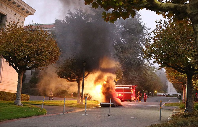 Fire and smoke are shown from an explosion Monday on the University of California Berkeley campus. At least one person was hospitalized and a mandatory evacuation was ordered after the explosion followed a power outage across the campus.