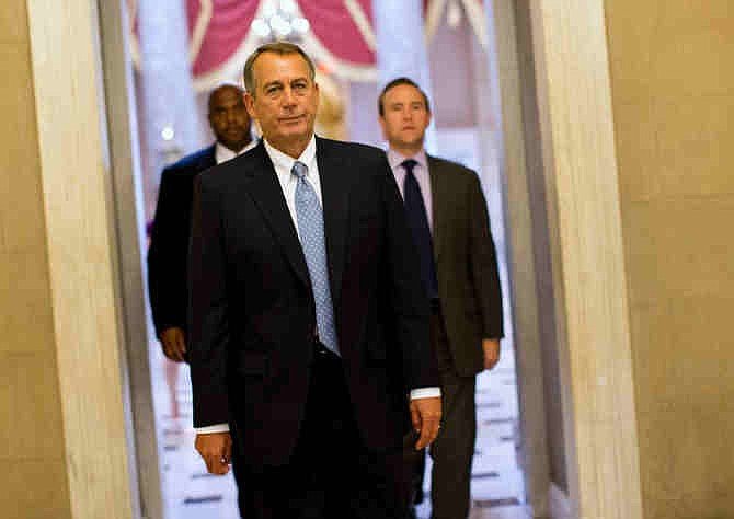 House Speaker John Boehner of Ohio walks to his office on Capitol Hill in Washington, Wednesday, Oct. 2, 2013.