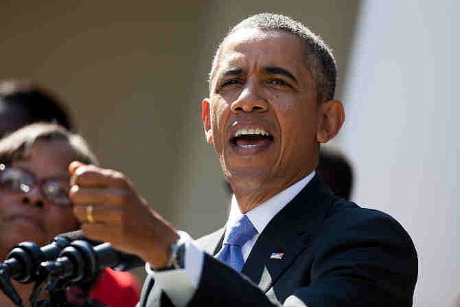 In this Oct. 1, 2013, photo, President Barack Obama gestures during a statement on the government shutdown in the Rose Garden of the White House in Washington. Obama's strategy during the partial shutdown of the federal government is aimed at keeping up the appearance of a leader focused on the public's priorities and avoiding looking tone deaf to the hundreds of thousands of Americans forced off the job. 