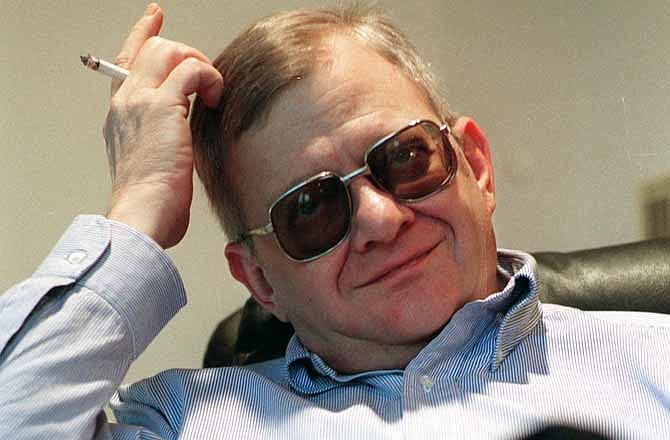 In this Feb. 4, 1998 file photo, writer Tom Clancy appears at his home in Calvert County, Md. Clancy, the bestselling author of more than 25 fiction and nonfiction books for the Penguin Group, died on Oct. 1, 2013 in Baltimore, Md. He was 66.