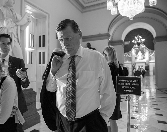 Rep. Tom Cole, R-Okla., walks to the chamber as Congress continues to struggle with the government shutdown, at the Capitol in Washington. President Barack Obama brought congressional leaders to the White House on Wednesday for the first time since a partial government shutdown began, but there was no sign of progress.