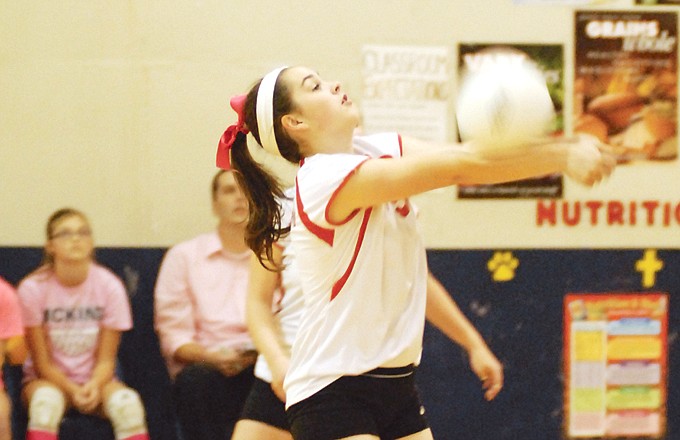 Calvary Lutheran's Brooke Rollins makes a return during Thursday night's match against Chamois at Trinity Lutheran Gym.