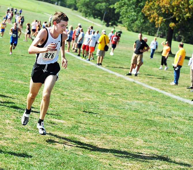 Jefferson City High School's Hampton Waggoner chases his shadow as he nears the finish line Friday at Oak Hills Golf Course. High school runners from across the state participated in the first of what the Jefferson City Convention and Visitors Bureau hopes to be an annual event.