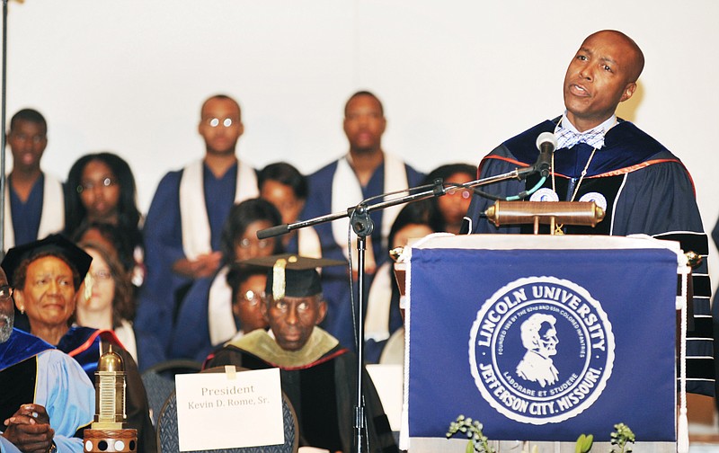 With previous presidents Carolyn Mahoney, at left, and James Frank, seated to the right of her, as guests, Kevin Rome delivers a brief speech Friday, Oct. 4, 2013 during inaugural ceremonies to swear him in at Lincoln University's 19th president.