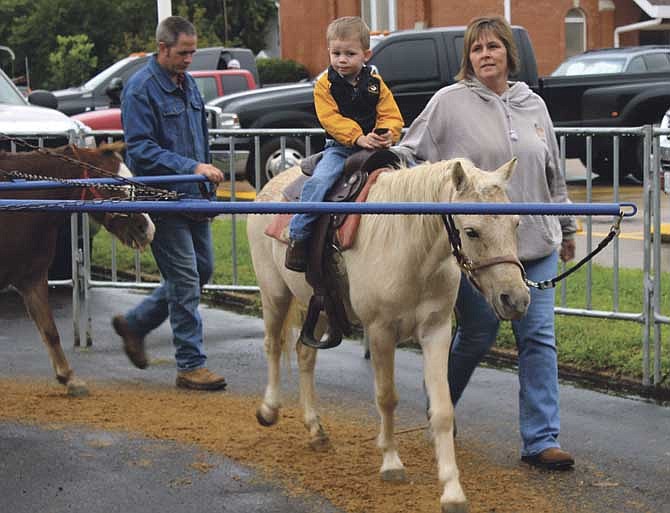 The Children's Fun Zone at the Versailles Old Tyme Apple Festival on Saturday included pony rides and other entertainment.