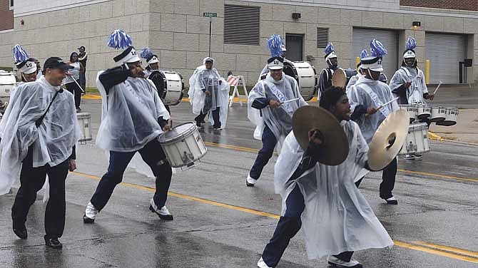 Despite the falling rain the spirit was up beat as the Lincoln University Marching Band kept beats flowing as they marched on East McCarty Street on Saturday during the annual Lincoln Homecoming parade. It's the first LU homecoming event for Kevin Rome, the school's new president, who says his first goal is to focus on students' experience at the university.