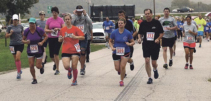 The first Missouri State Employees 5K race was held Saturday in Jefferson City despite a down pouring of rain.