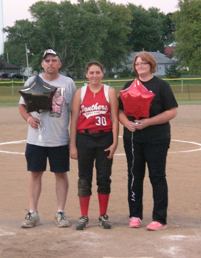 Jim and Teresa Kennedy join their daughter Jessie Kennedy on the field at Lady Panther Softball Senior Night.