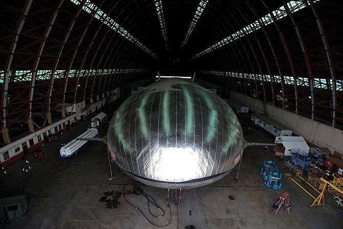 The Aeroscraft airship, a high-tech prototype airship, is seen inside a World War II-era hangar in Tustin, Calif. The $35 million lighter-than-air dirigible was damaged and began leaking helium when part of the hangar roof collapsed Monday at a former Marine base in Southern California, authorities said. 