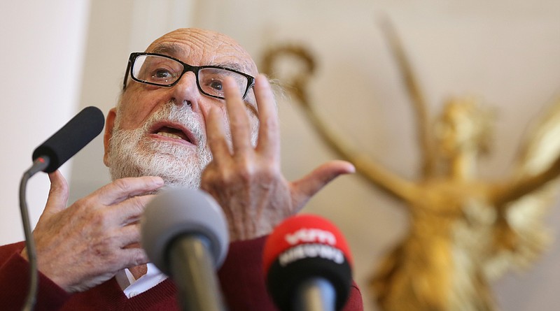 Nobel Prize winner for Physics, Belgium's Francois Englert, speaks Tuesday during a news conference at the University of Brussels in Brussels. Englert and Peter Higgs of Britain won the 2013 Nobel Prize in physics on Tuesday for their theory on how the most basic building blocks of the universe acquire mass, eventually forming the world we know today.