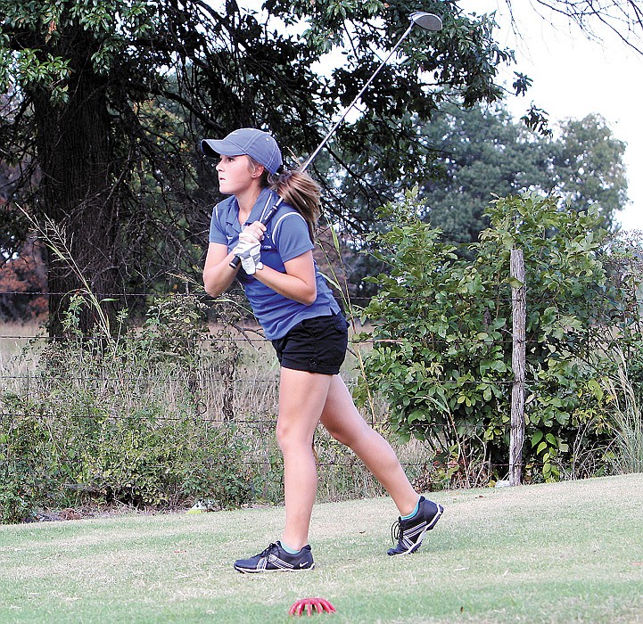 California sophomore Sophie Brant watches her ball drop at the triangular golf match Oct. 2 at the California Country Club. Brant and Haley Goans (not shown) earned All-District honors at the Class 1 District 2 Tourney Monday at Eugene, as they were among the top 15 finishers.
