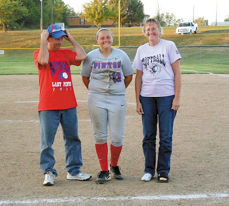 Senior members of the California High School varsity softball team were recognized along with their parents following the varsity game against Osage Oct. 1 at the California Sports Complex. Above is senior Tiffany Carel with her parents Terry and Sue Carel.