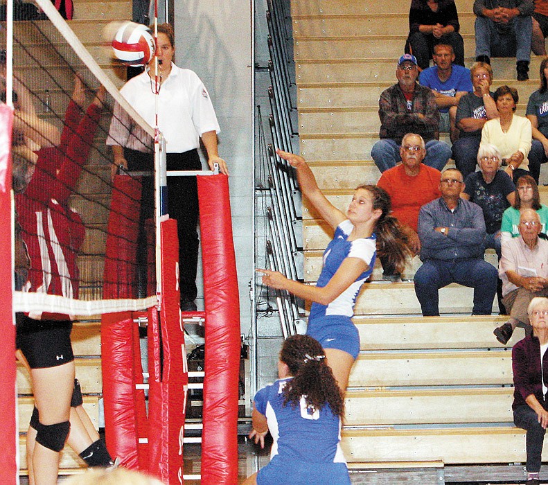 California junior Kamryn Koetting executes a kill during the first set of the varsity match against Tipton Monday at California High School. The Lady Pintos defeated the Lady Cardinals 25-11, 25-12.