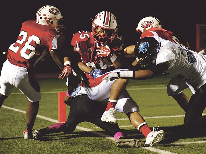 Jefferson City running back Jerry McMillian gets stopped short of the end zone by the Gateway Tech defense after picking up big yardage on a run down the sideline during Friday night's homecoming football game at Adkins Stadium.