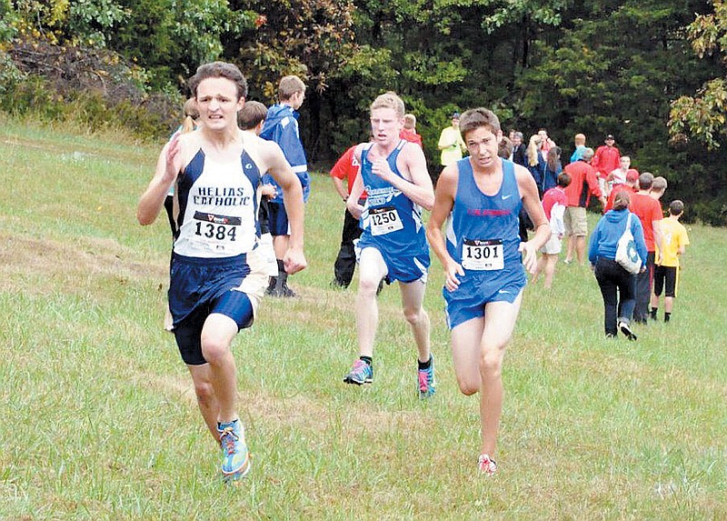 California's Adam Burkett, at right, competes at the Helias Invitational Saturday at Binder Park, Jefferson City. Behind Burkett, at center, is Russellville's Alex M. Thompson. 