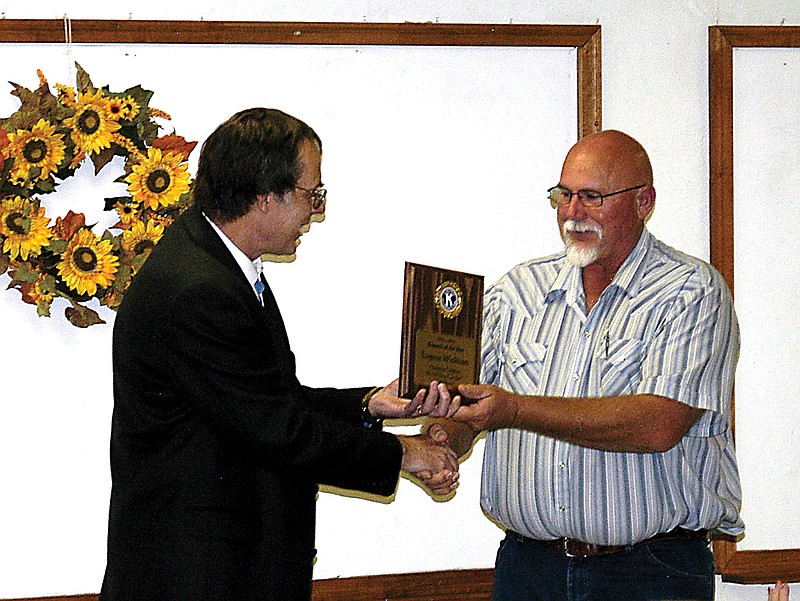 California Kiwanis Past President Dr. Peter Kurowski, left, presents outgoing President Eugene Wickham with a plaque in recognition of his service.