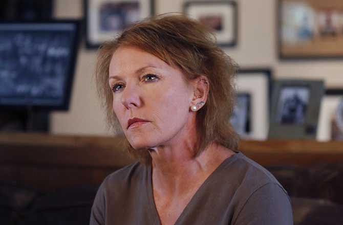 Melinda Coleman listens to a question during an interview in her home in Albany, Mo., Wednesday, Oct. 16, 2013. Coleman maintained justice was denied when charges were dropped against the boys that her 14-year-old daughter said sexually assaulted her and a 13-year-old friend. 