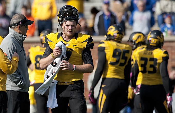 Missouri head coach Gary Pinkel talks with quarterback Maty Mauk prior to Saturday's game against Florida at Faurot Field.