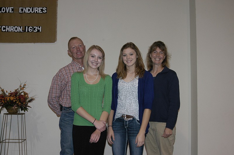 Democrat photo / David A. Wilson
The Eschenbrenner family of Jamestown, front row, from left, daughters Holly and Robyn, and back row, parents Barry and Heidi, are involved in Farm Bureau activities. Holly is a candidate for Missouri Farm Bureau Ambassador. Barry is a member of the Moniteau County Farm Bureau Board and Direct Marketing and Commodities chairman. 