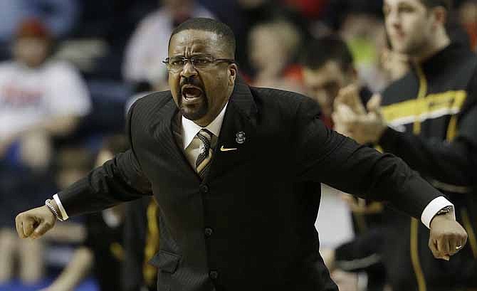 In this March 15, 2013, file photo, Missouri head coach Frank Haith speaks to players during the second half of an NCAA college basketball game against Mississippi at the Southeastern Conference tournament, in Nashville, Tenn.