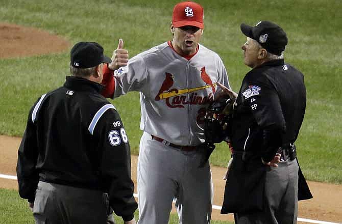 St. Louis Cardinals manager Mike Matheny argues a call during the first inning of Game 1 of baseball's World Series against the Boston Red Sox Wednesday, Oct. 23, 2013, in Boston. 
