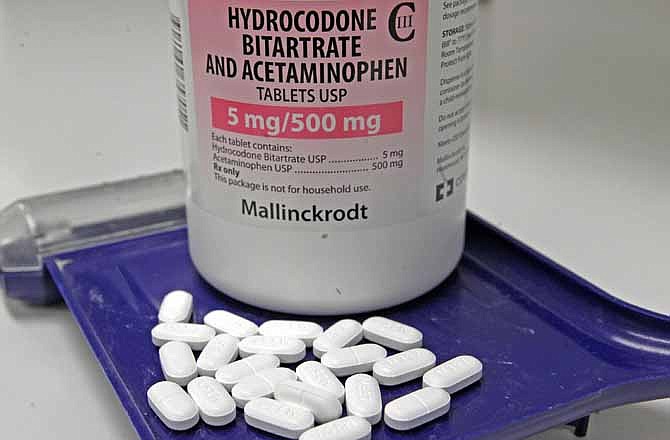 In this Feb. 19, 2013 file photo, hydrocodone bitartrate and acetaminophen pills, also known as Vicodin, are arranged for a photo at a pharmacy in Montpelier, Vt. 