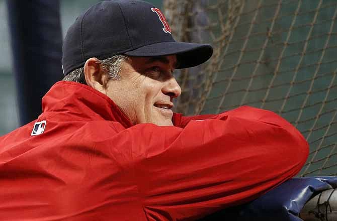 Boston Red Sox manager John Farrell watches batting practice before Game 1 of baseball's World Series against the St. Louis Cardinals Wednesday, Oct. 23, 2013, in Boston.