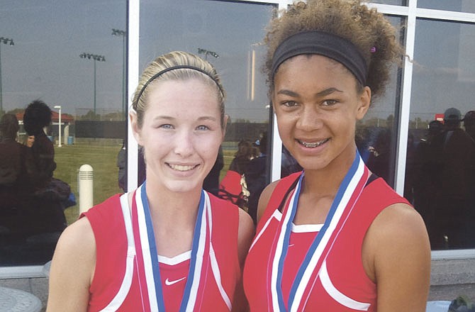 Jefferson City teammates Paige Smith (left) and Eden Hoogveld pose with their state tennis medals Saturday.