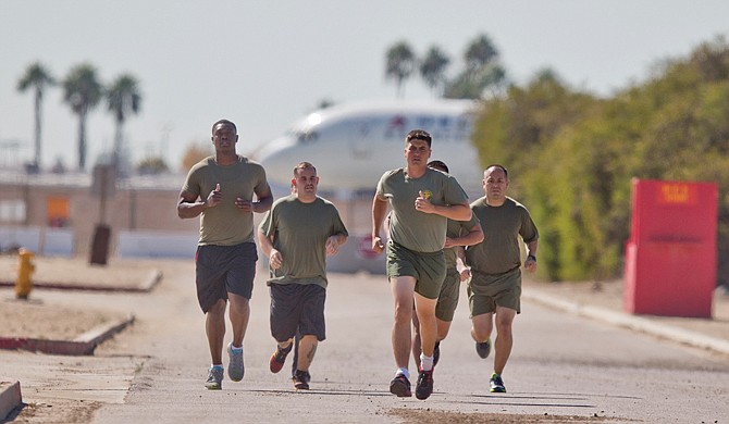 A group of sailors and Marines who failed the so-called "tape test'' are led by an instructor on a three mile run as they work to improve their fitness and remain in the military, at the Marine Corps Recruit Depot in San Diego.