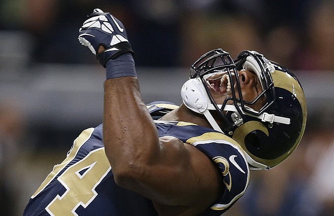 Robert Quinn of the Rams celebrates after sacking Seahawks quarterback Russell Wilson during the first quarter of Monday night's game at the Edward Jones Dome. 