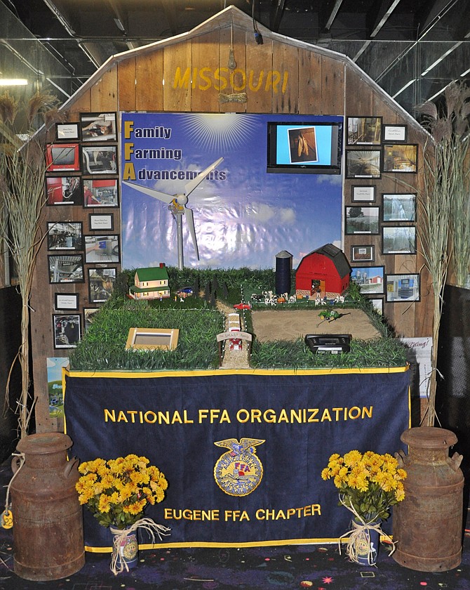 The Eugene FFA Chapter's educational booth team will represent Missouri at the national convention competition today in Louisville, Ky. This barn-shaped display includes miniatures of several technologies being used in Mid-Missouri farms, such as solar panels, remote-controlled machinery and automated dairy farms. 