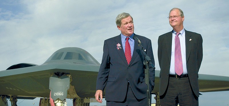 With a B-2 stealth bomber in the background, U.S. Sen. Kit Bond, R-Mo., left, and Rep. Ike Skelton, D-Mo., talk to the media Oct. 19, 2001, during a visit Whiteman Air Force Base in Knob Noster. Skelton, who died Monday at 81, served many years on the Armed Forces Committee.