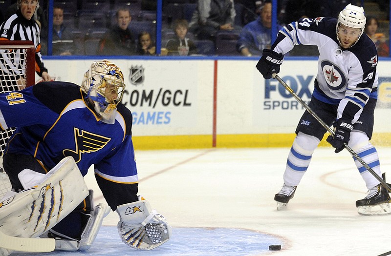 Blues' goalie Jaroslav Halak blocks a shot by Grant Clitsome of the Jets during Tuesday night's game in St. Louis.