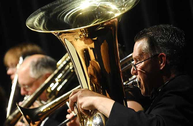 Tuba player Bruce Connor keeps his eyes on the conductor as the Jefferson City Symphony Orchestra performs during a concert last year at Lincoln University's Mitchell Auditorium. (File photo)