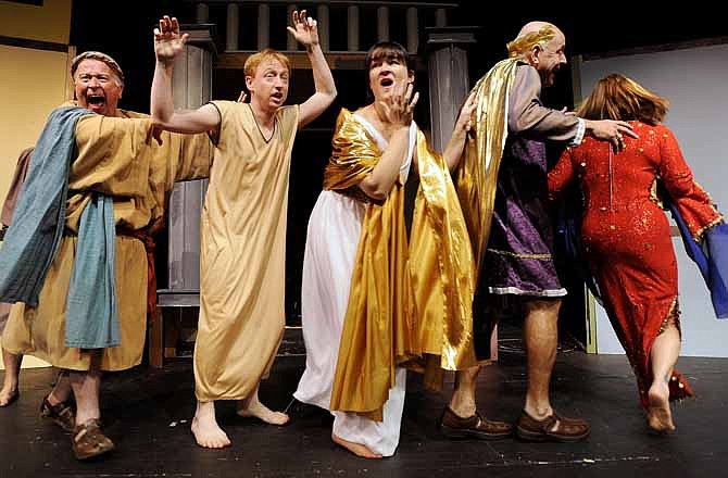 Roman slaves, virgins, senators and courtesans chase after each other as cast members in the Capital City Players' upcoming production of "A Funny Thing Happened on the Way to the Forum" run through a rehearsal at Shikles Auditorium in Jefferson City. 