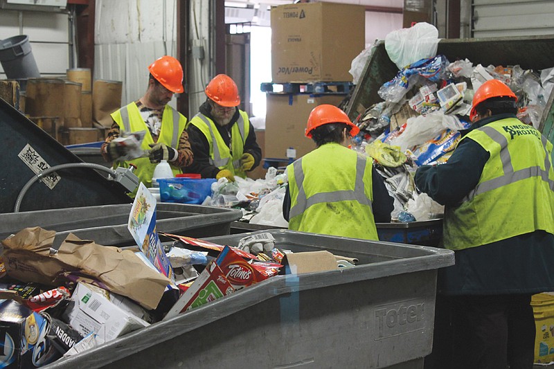 Workers at Kingdom Projects help sort and process recycled cardboard and paper at their recycling plant, 2611 North Bluff St. The sheltered workshop, which provides jobs in recycling, packaging, assembly and more, is working to rebrand itself and raise awareness among the public in Callaway County to its services.
