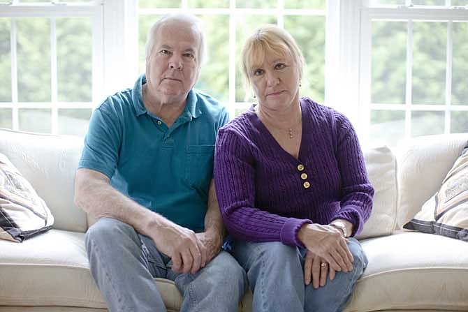 Dean and Mary Lou Griffin sit their home in Chadds Ford, Pa. on Friday, Nov. 1, 2013. The Griffins are among millions of people nationwide who buy individual insurance policies and are receiving notices that those policies are being discontinued because they don't meet the higher benefit requirements of the new law.