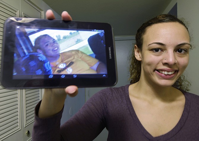 Chelsea Hale holds a photo of herself made three years ago at the age of 17 before she had obesity surgery, in Fairfield, Ohio. Hale had weighed 314 pounds and is now about 170 pounds. A government-funded study published online Monday in JAMA Pediatrics shows teens seeking weight-loss surgery have a startling number of health problems that used to be seen only in adults. 