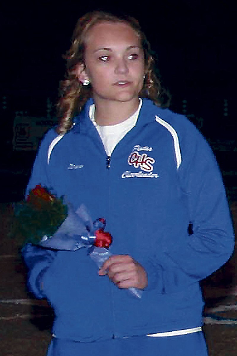 Democrat photo / April Arnett
Senior cheerleader Drew Rubert escorted by CHS Cheerleading Coach Alysha Connell.