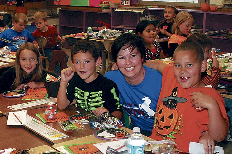 Democrat photos / April Arnett
Students in Denice Wise's first grade class (currently taught by substitute teacher Cathy Lovins at far left)  enjoy the Halloween party Thursday.