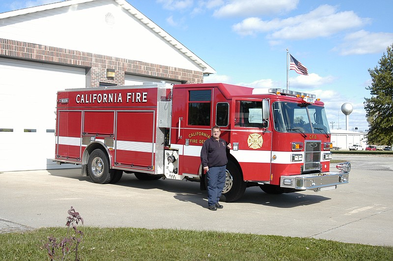 
The new custom-built 2013 Pierce Saber fire truck shown by Fire Chief Allen Smith is the latest addition to the City of California Volunteer Fire Department. 