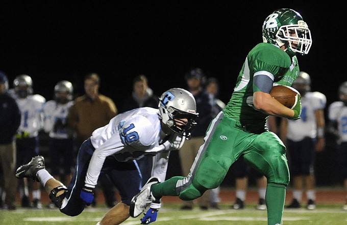 Blair Oaks running back Caleb Bischoff pulls away from Tolton defensive back Clay Harrison on his way to a 40-yard touchdown run last Thursday at the Falcon Athletic Complex.