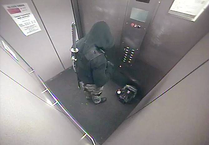 Senior David Kyem, son of CCSU geography professor Peter Kyem, is seen in a surveillance photo in an elevator of a Central Connecticut State University campus building in New Britain, Conn. Reports of a person carrying a sword led to a 3-hour campus lockdown.