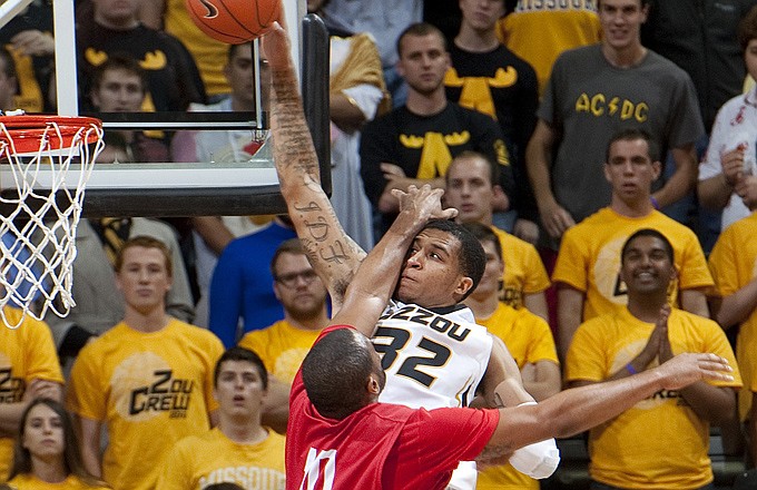 Missouri's Jabari Brown (right) gets fouled by Central Missouri's Brennen Hughes while trying to dunk the ball during last Friday's exhibition game in Columbia.