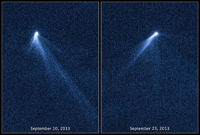 This combination of Sept. 10 and 23, 2013 photos provided by NASA shows six comet-like tails radiating from a body in the asteroid belt, designated P/2013 P5. The Hubble Space Telescope discovered it in the asteroid belt between the orbits of Mars and Jupiter. A research team led by the University of California at Los Angeles believes the asteroid is rotating so much that its surface is flying apart. It's believed to be a fragment of a larger asteroid damaged in a collision 200 million years ago.