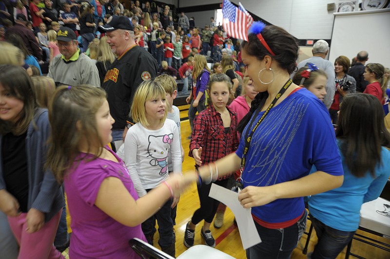 First-year teacher Nicole Ball received "thank-yous" from many students Friday following the Veterans Day Assembly at Cole County R-1 Schools. Ball has been in the Missouri National Guard for seven years and is currently a food operations sergeant with an aviation unit. She is a speech implementor and dance team coach.