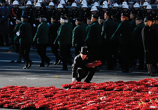 A steward places a wreath during the service of remembrance at the Cenotaph in Whitehall, London, Sunday. The annual remembrance service forthose who have lost their lives serving in the Armed Forces.
