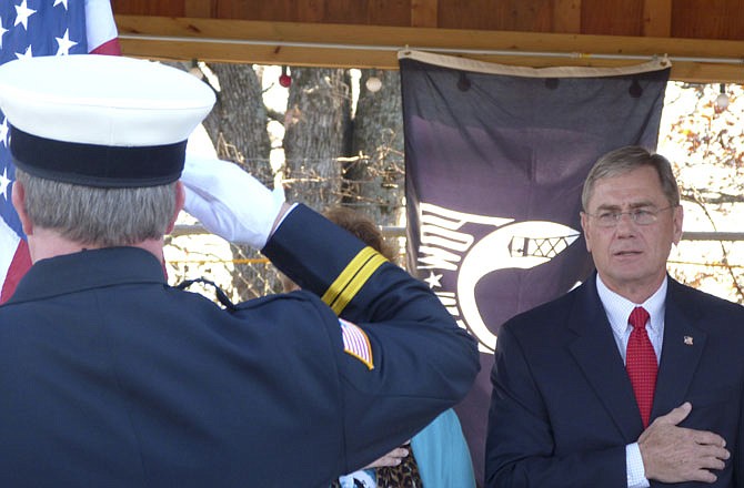 U.S. Rep. Blaine Luetkemeyer, R-Mo., joins in the Pledge of Allegiance during the dedication ceremony of a new pavilion at the Greenview Elks Lodge. 