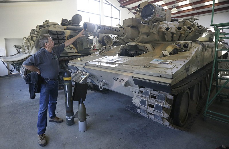 William Boller, president and CEO of Military Vehicle Technology Foundation, talks while standing next to an Airborne Assault Vehicle from the United States displayed in Portola Valley, Calif.