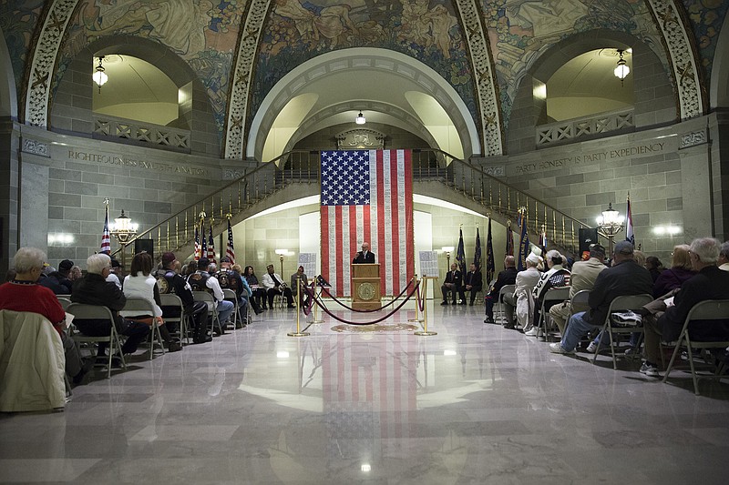 Speaker John W. Clark, a retired Air Force colonel, addresses the Rotunda audience Monday morning. 
